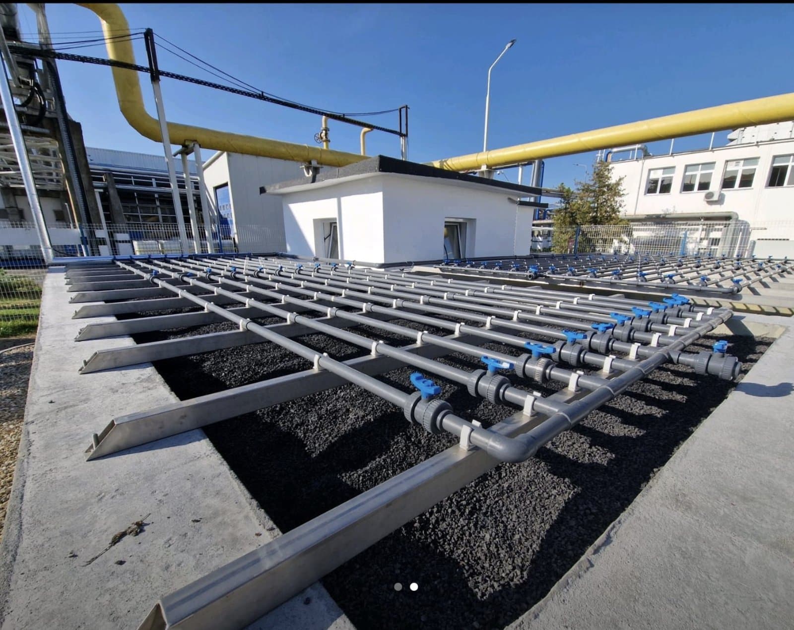 Klarwin biological treatment plant — surface aeration manifold over filter media beds