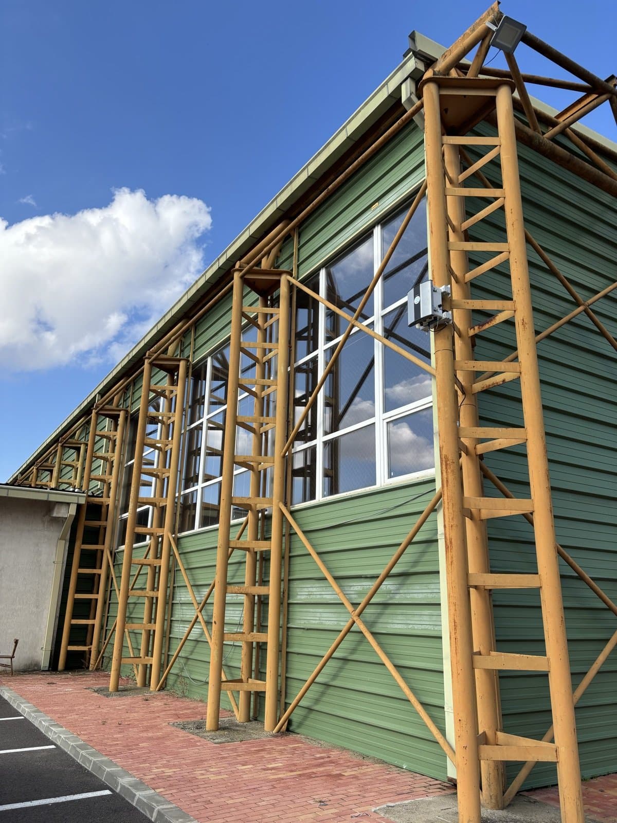Polludrone station installed on a green-roofed hall with timber trusses